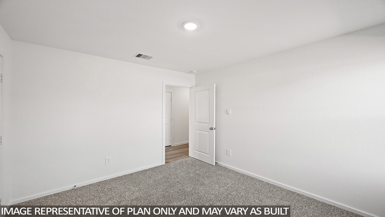 152 Baby Calf Roping Road Jarrell, TX 76537 - Photo 17 of 23 Spacious room featuring clean white walls, grey carpet flooring, a white two-panel interior door, and recessed ceiling lighting