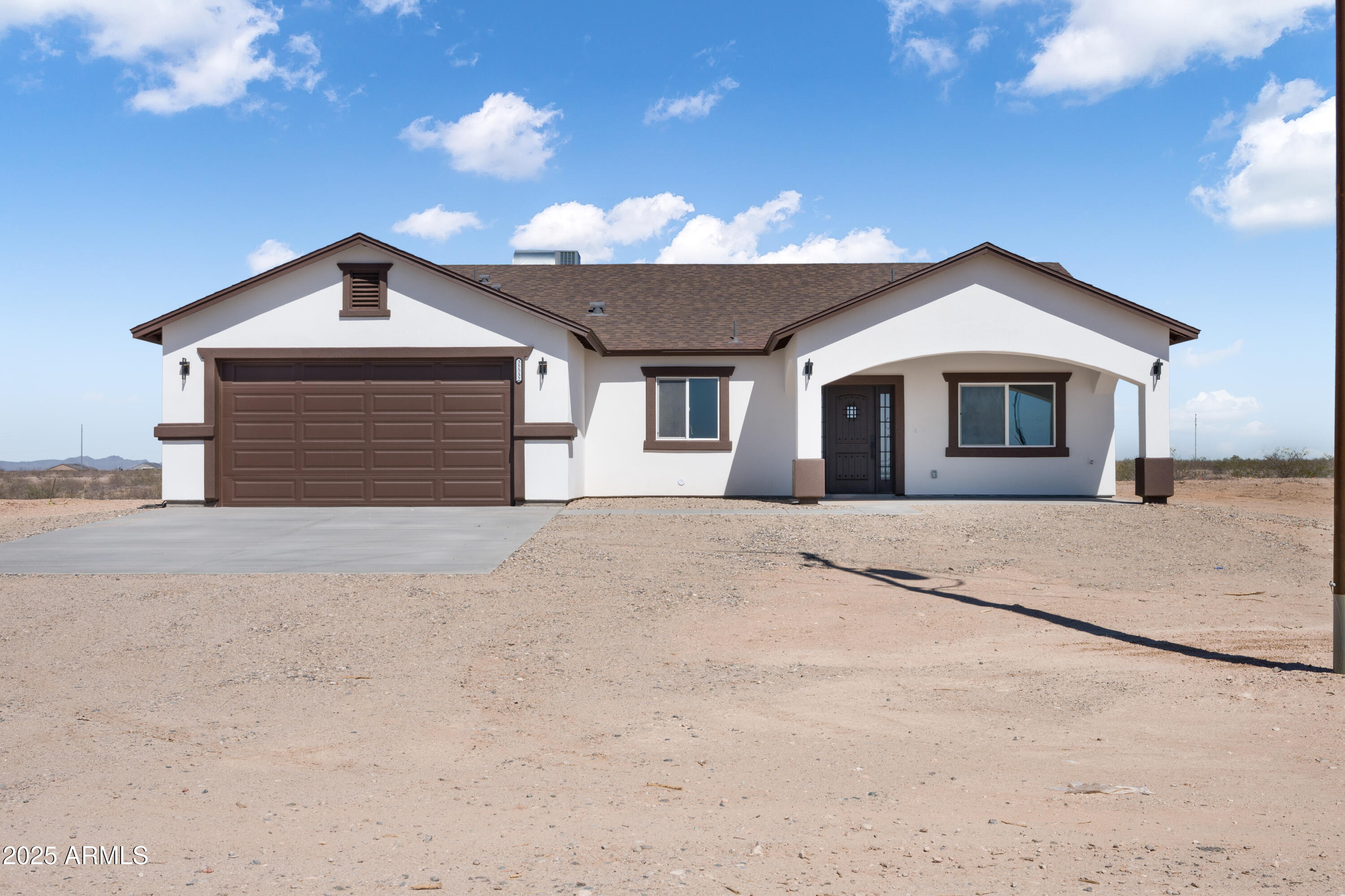 a view of a house with a yard and garage