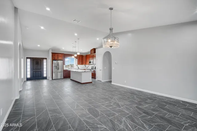 a view of a kitchen with a sink and cabinets