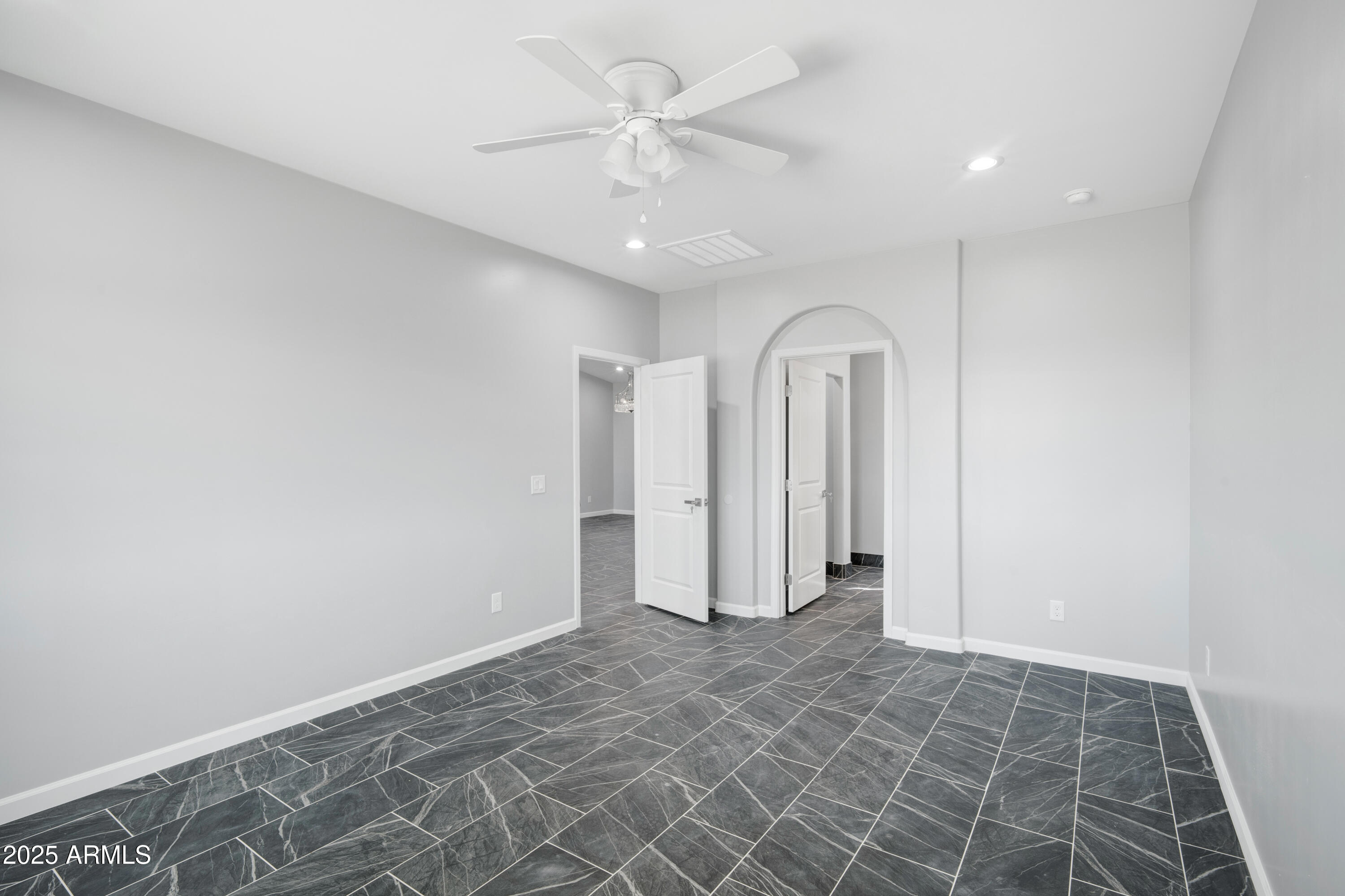 35532 West Chipman Road Tonopah, AZ 85354 - Photo 17 of 30 an empty room with a ceiling fan and shower