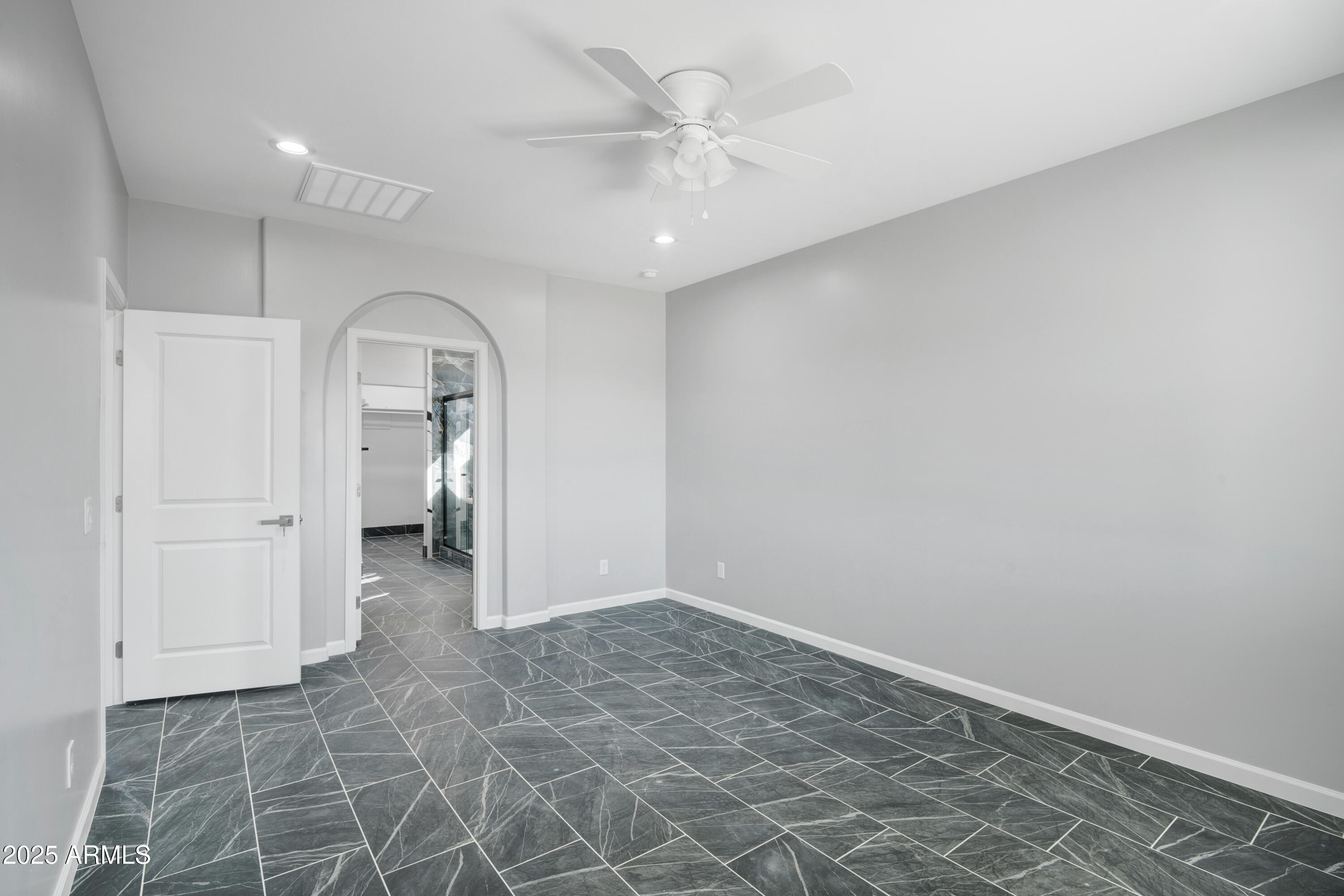35532 West Chipman Road Tonopah, AZ 85354 - Photo 18 of 30 an empty room with a space and a ceiling fan