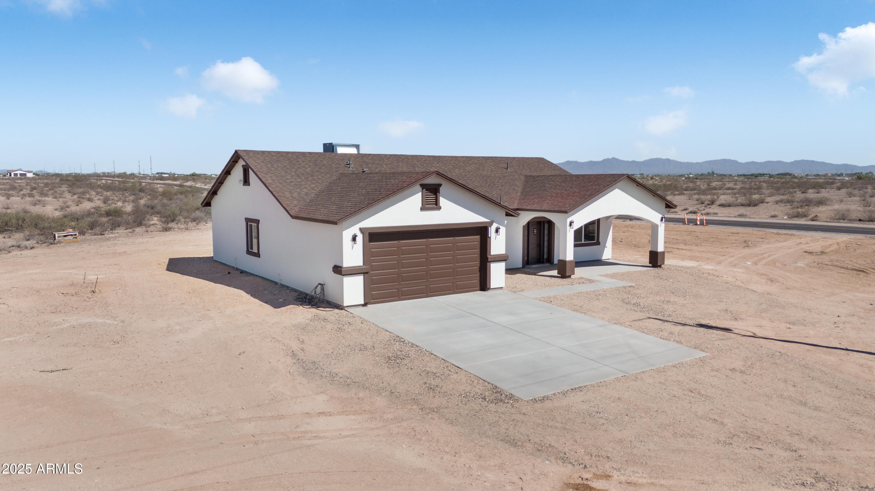 35532 West Chipman Road Tonopah, AZ 85354 - Photo 2 of 30 a front view of a house with a yard