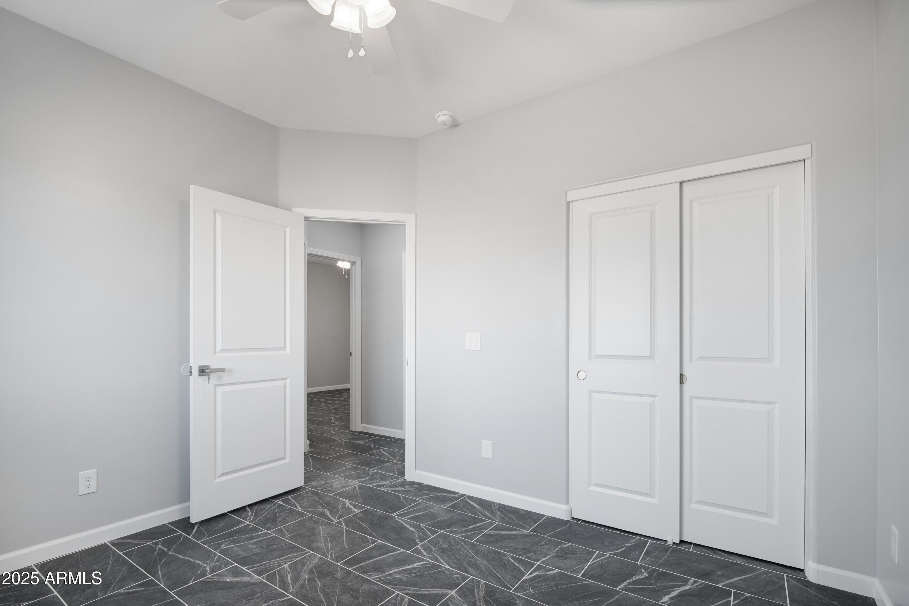 35532 West Chipman Road Tonopah, AZ 85354 - Photo 23 of 30 an empty room with closet and windows