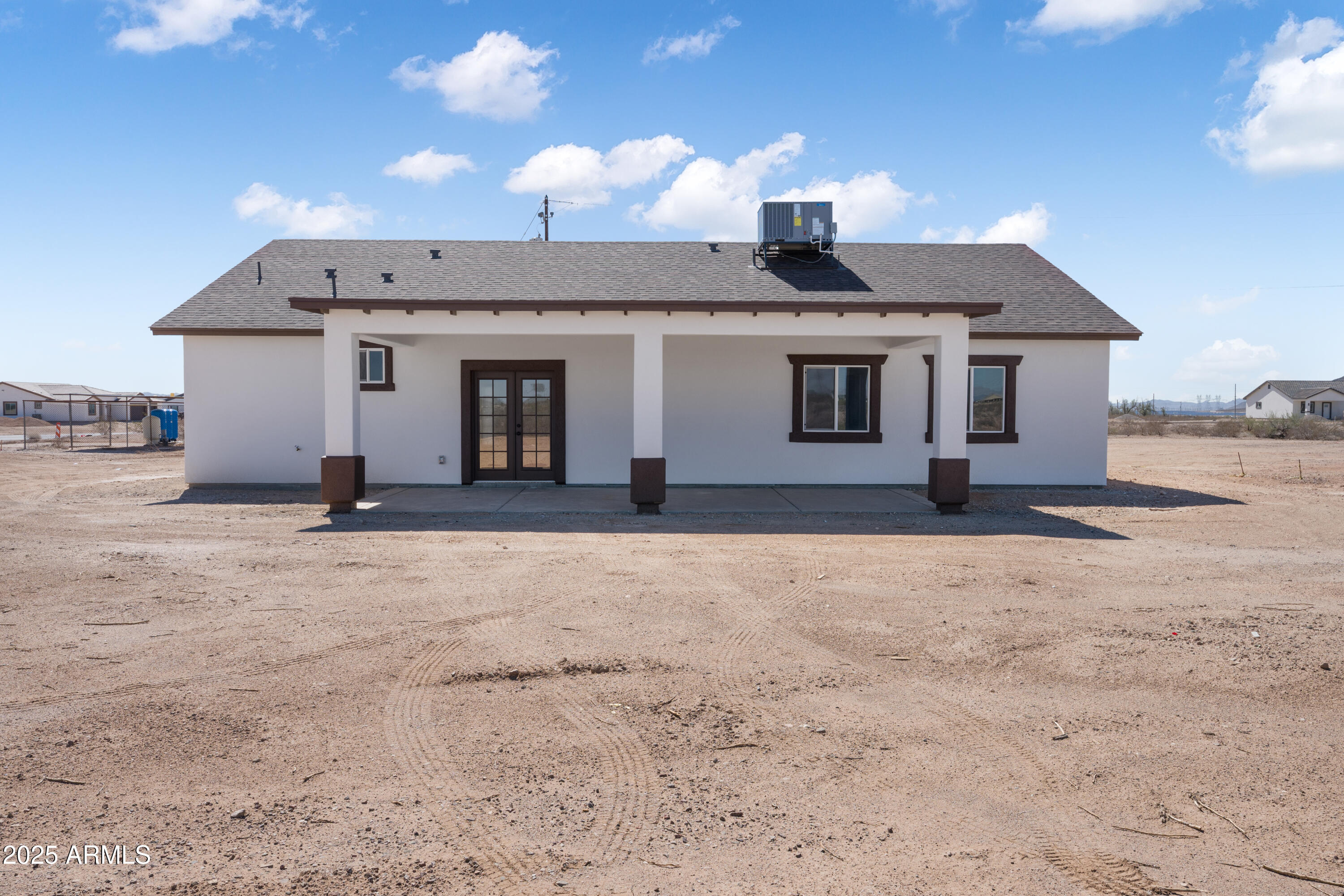 35532 West Chipman Road Tonopah, AZ 85354 - Photo 5 of 30 a front view of a house with a yard