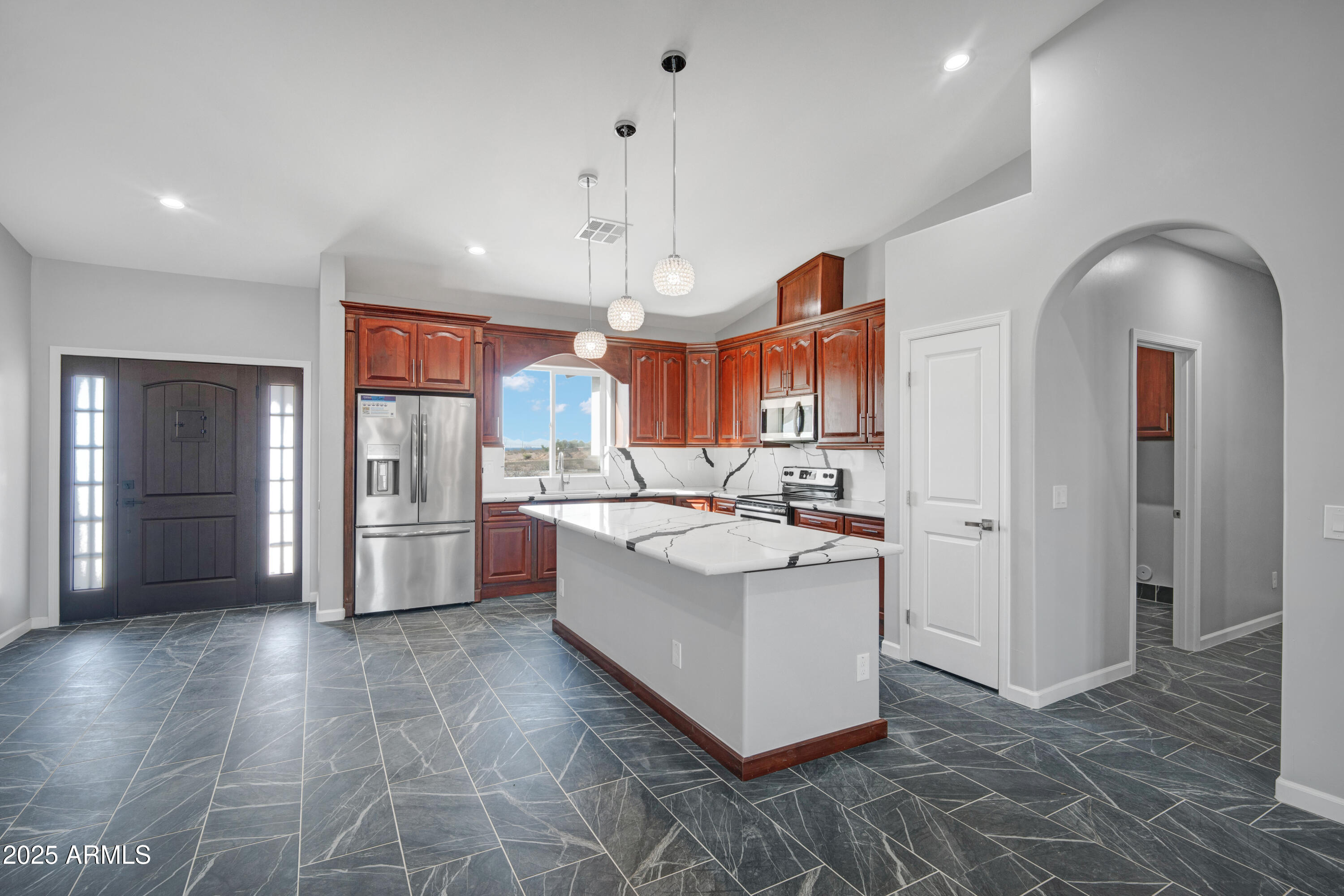 35532 West Chipman Road Tonopah, AZ 85354 - Photo 9 of 30 a large white kitchen with a sink and refrigerator