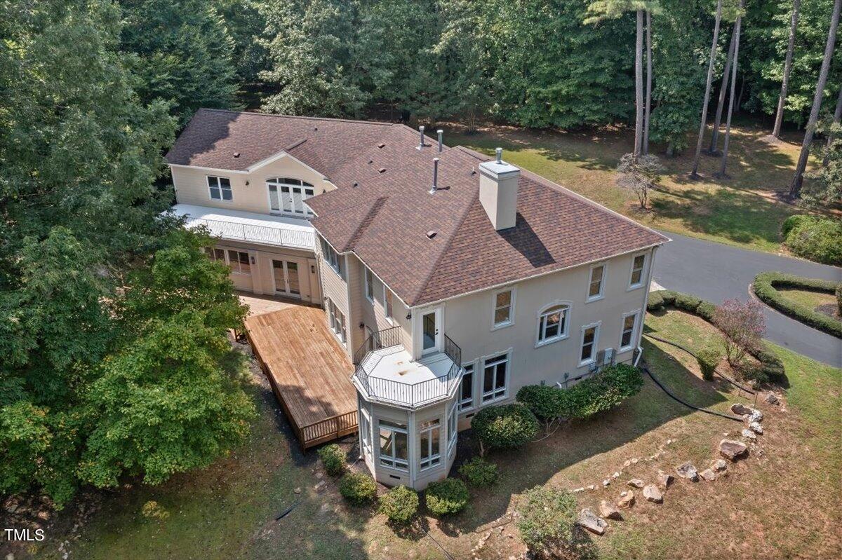 6300 Swallow Cove Lane Raleigh, NC 27614 - Photo 60 of 67 an aerial view of a house with a yard patio and fire pit