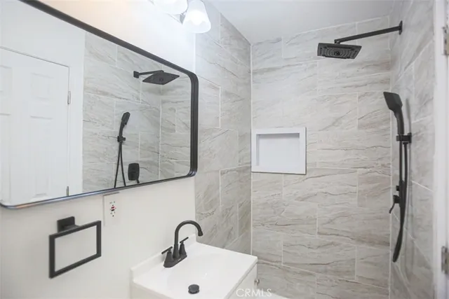 a bathroom with a sink and mirror