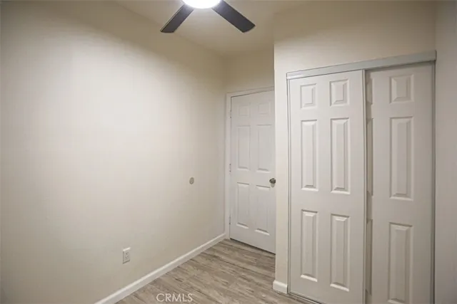 an empty room with closet area