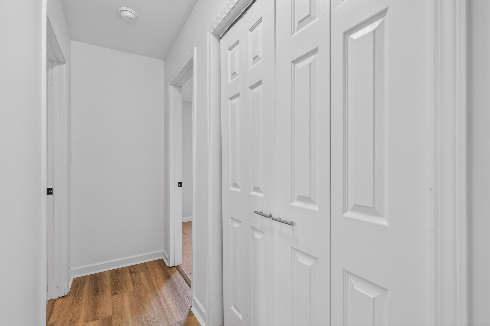 105 East Renoir Road DeFuniak Springs, FL 32433 - Photo 14 of 29 a view of a hallway with wooden floor