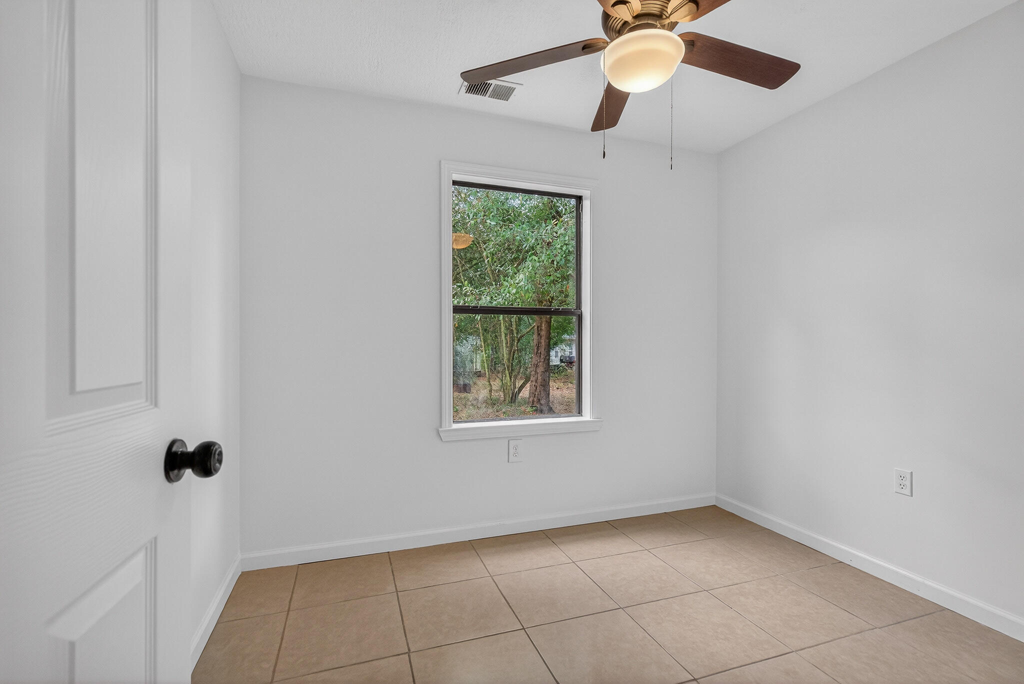 105 East Renoir Road DeFuniak Springs, FL 32433 - Photo 16 of 29 a view of an empty room with a window