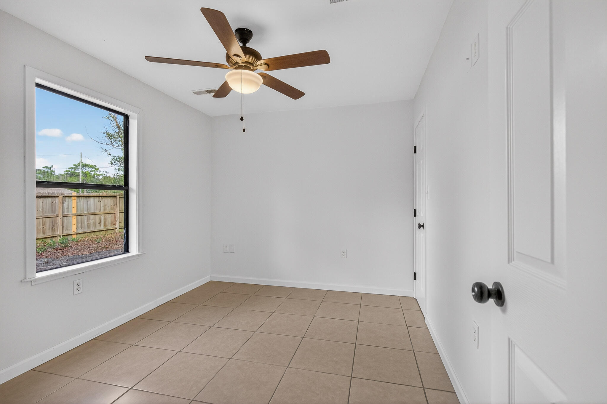 105 East Renoir Road DeFuniak Springs, FL 32433 - Photo 17 of 29 a view of an empty room with a window