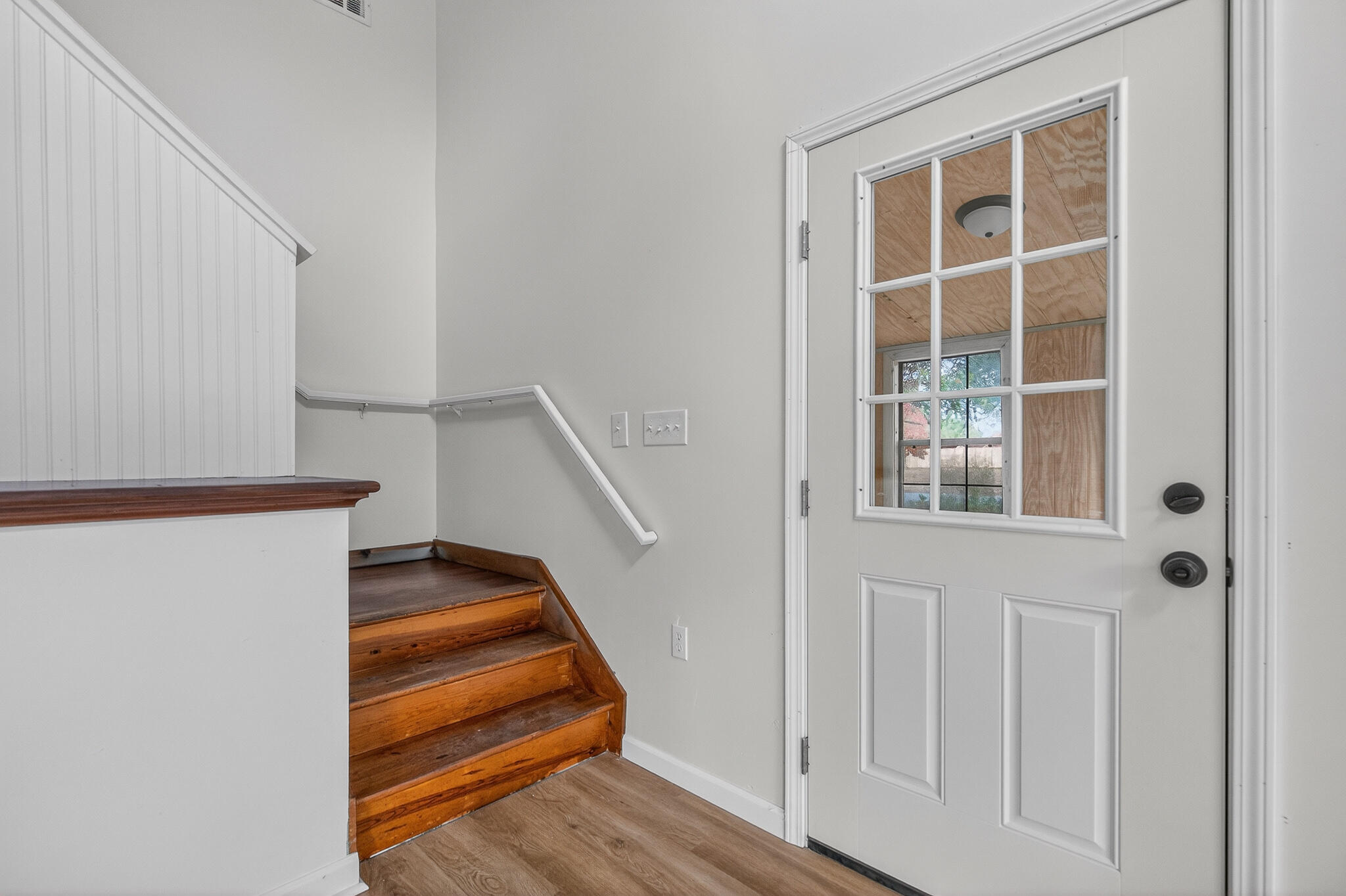 105 East Renoir Road DeFuniak Springs, FL 32433 - Photo 19 of 29 a view of entryway with wooden floor and stairs