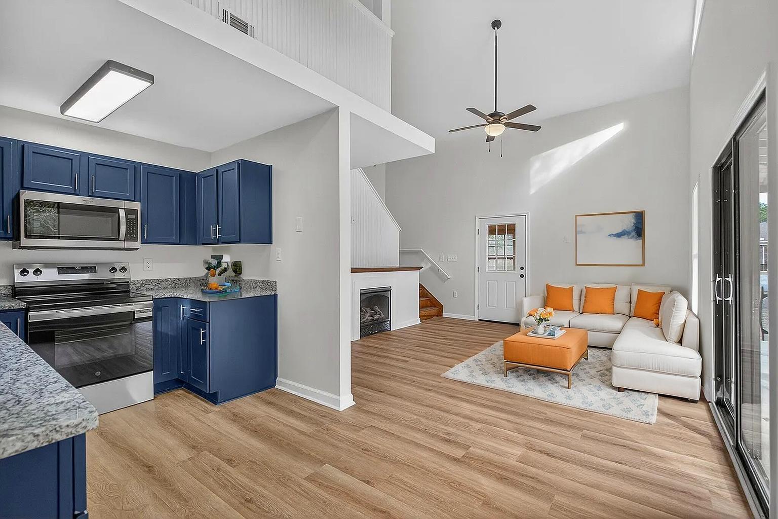 105 East Renoir Road DeFuniak Springs, FL 32433 - Photo 8 of 29 a kitchen with furniture wooden floor and a fireplace