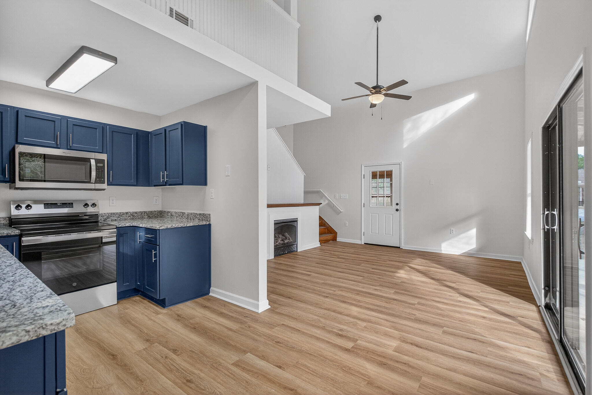 105 East Renoir Road DeFuniak Springs, FL 32433 - Photo 9 of 29 a kitchen with granite countertop a stove cabinets and stainless steel appliances