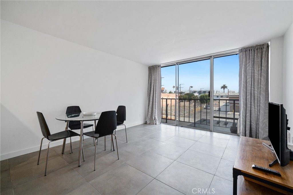 375 Atlantic Avenue, Unit 201 Long Beach, CA 90802 - Photo 11 of 21 a view of a workspace with furniture and a window