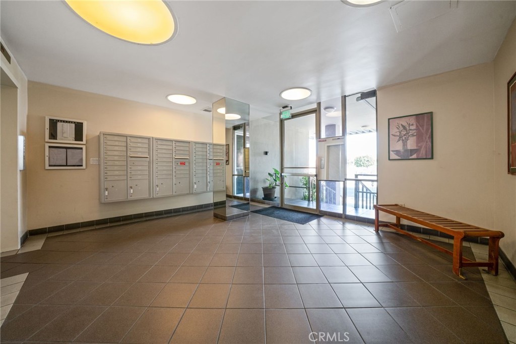 375 Atlantic Avenue, Unit 201 Long Beach, CA 90802 - Photo 5 of 21 a view of a livingroom with furniture and an empty room