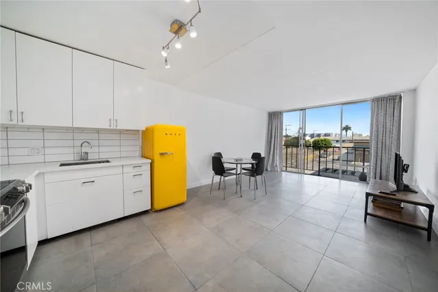 a view of kitchen with furniture and natural light