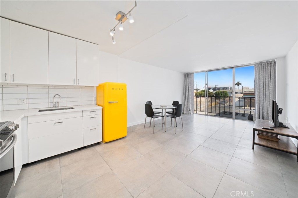 375 Atlantic Avenue, Unit 201 Long Beach, CA 90802 - Photo 10 of 21 a view of kitchen with counter top space cabinets and appliances