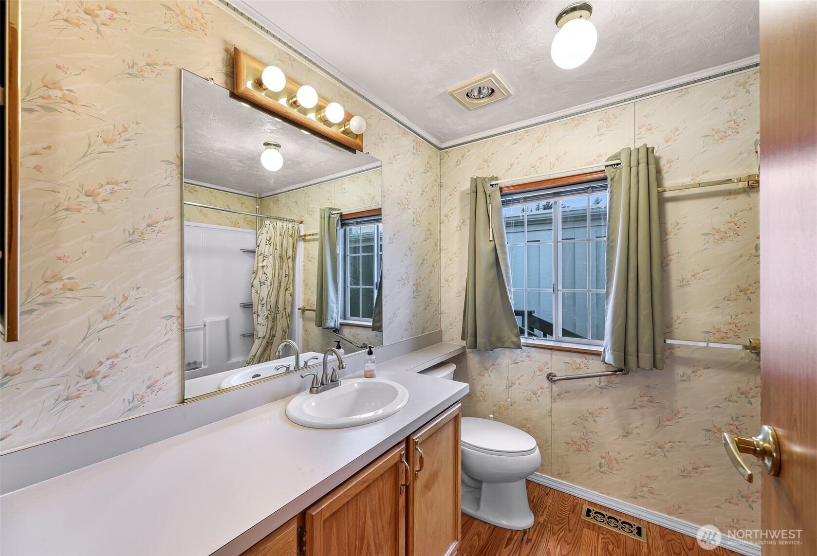 2015 24th Street, Unit 101 Bellingham, WA 98225 - Photo 12 of 40 a bathroom with a sink a toilet and shower