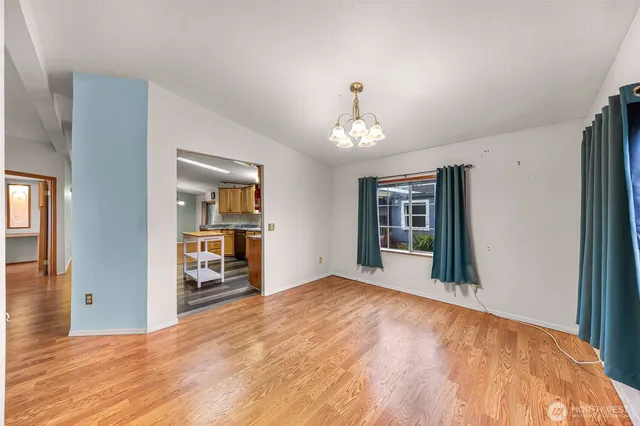 a kitchen with stainless steel appliances granite countertop sink stove top oven and cabinets