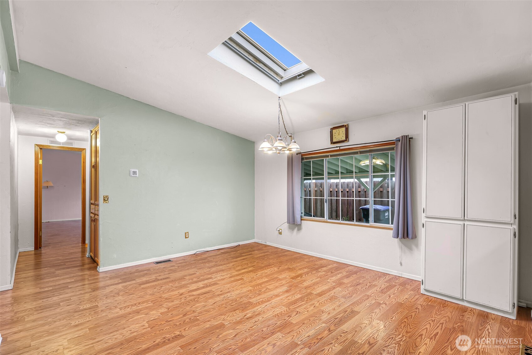 2015 24th Street, Unit 101 Bellingham, WA 98225 - Photo 23 of 40 a view of an empty room with wooden floor and a window