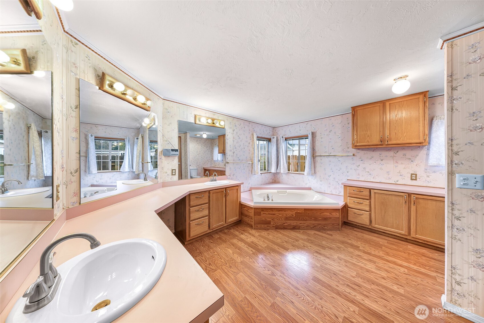 2015 24th Street, Unit 101 Bellingham, WA 98225 - Photo 27 of 40 a large bathroom with a granite countertop sink a bathtub and mirror