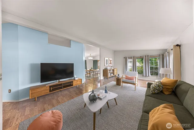 a living room with furniture and a table