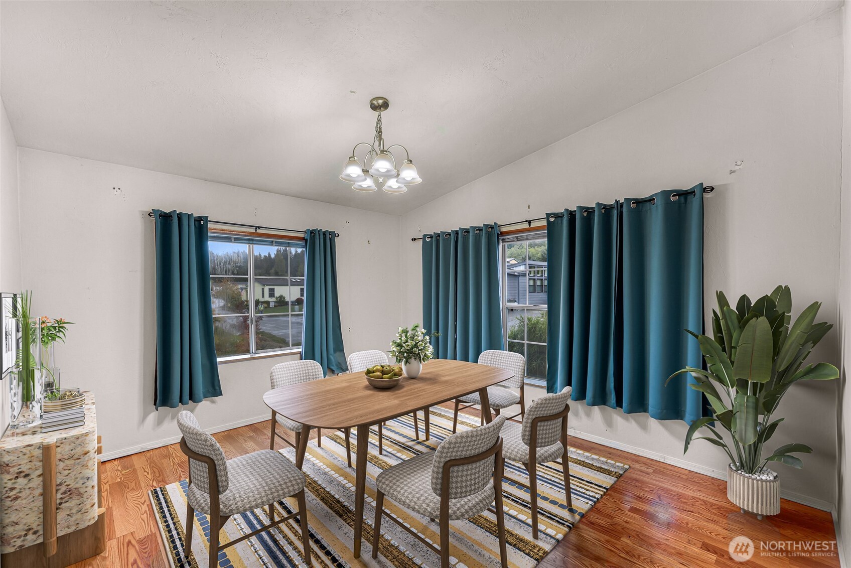 2015 24th Street, Unit 101 Bellingham, WA 98225 - Photo 8 of 40 a view of a dining room with furniture window and wooden floor