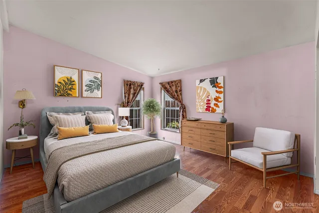 a large bedroom with a large bed and furniture