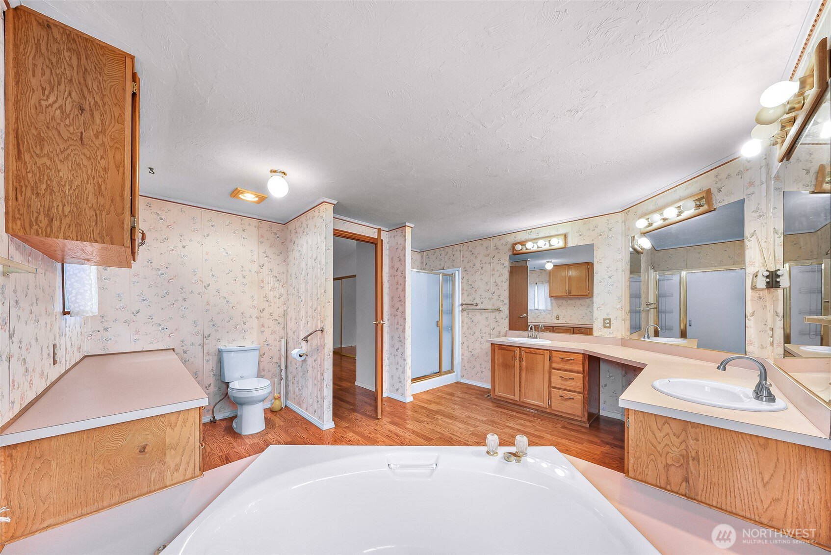 2015 24th Street, Unit 101 Bellingham, WA 98225 - Photo 10 of 40 a large bedroom with a large bed and furniture