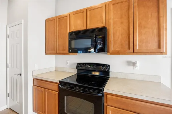 a kitchen with a stove and a microwave