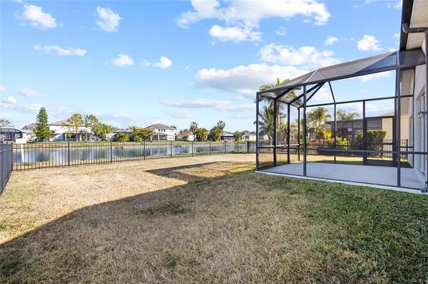 a view of a swimming pool with an outdoor seating