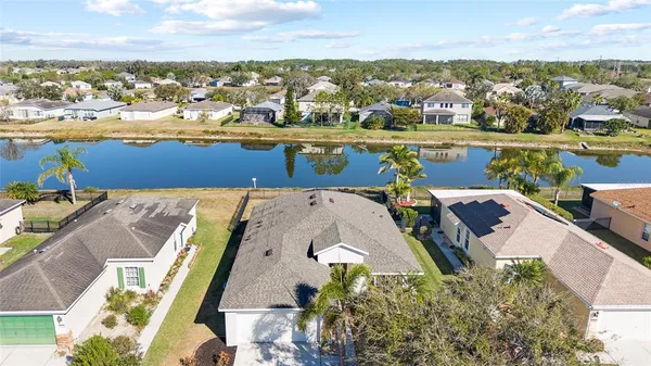 an aerial view of a house with a ocean view