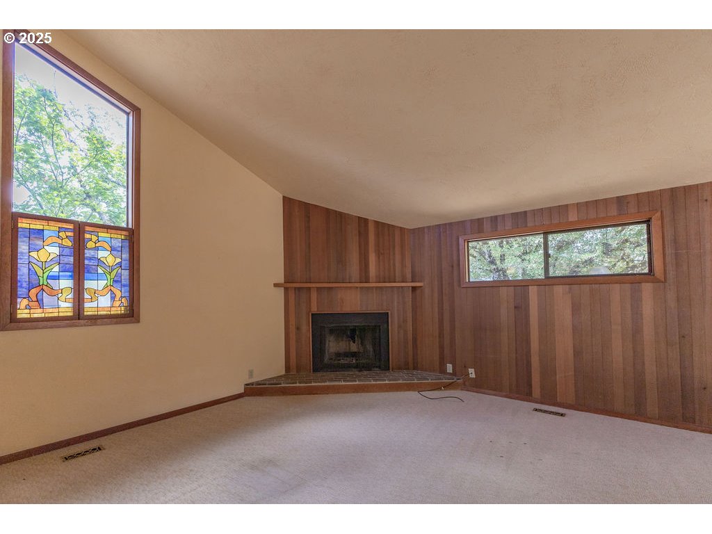 2116 Sally Way Eugene, OR 97401 - Photo 14 of 39 a view of empty room with fireplace and window