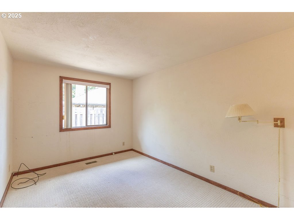 2116 Sally Way Eugene, OR 97401 - Photo 22 of 39 a view of an empty room with a window