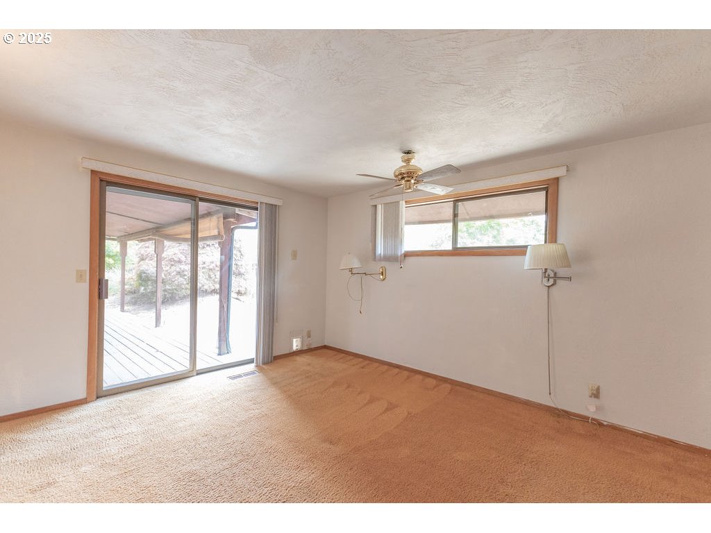 2116 Sally Way Eugene, OR 97401 - Photo 29 of 39 a view of an empty room with a window