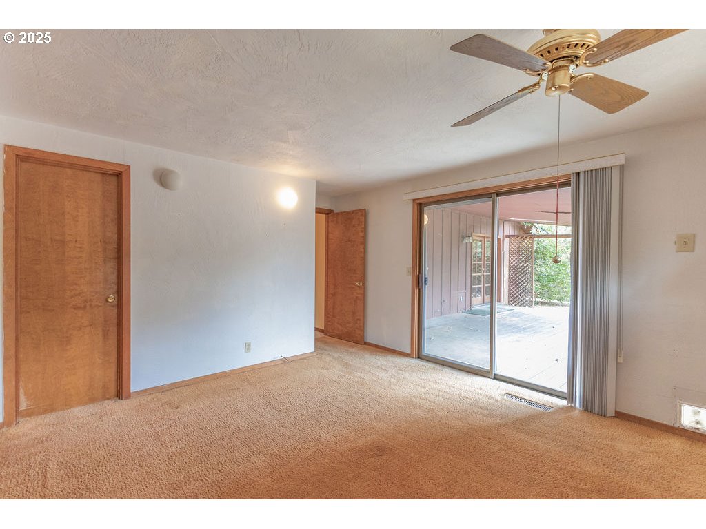 2116 Sally Way Eugene, OR 97401 - Photo 30 of 39 a view of an empty room with a window