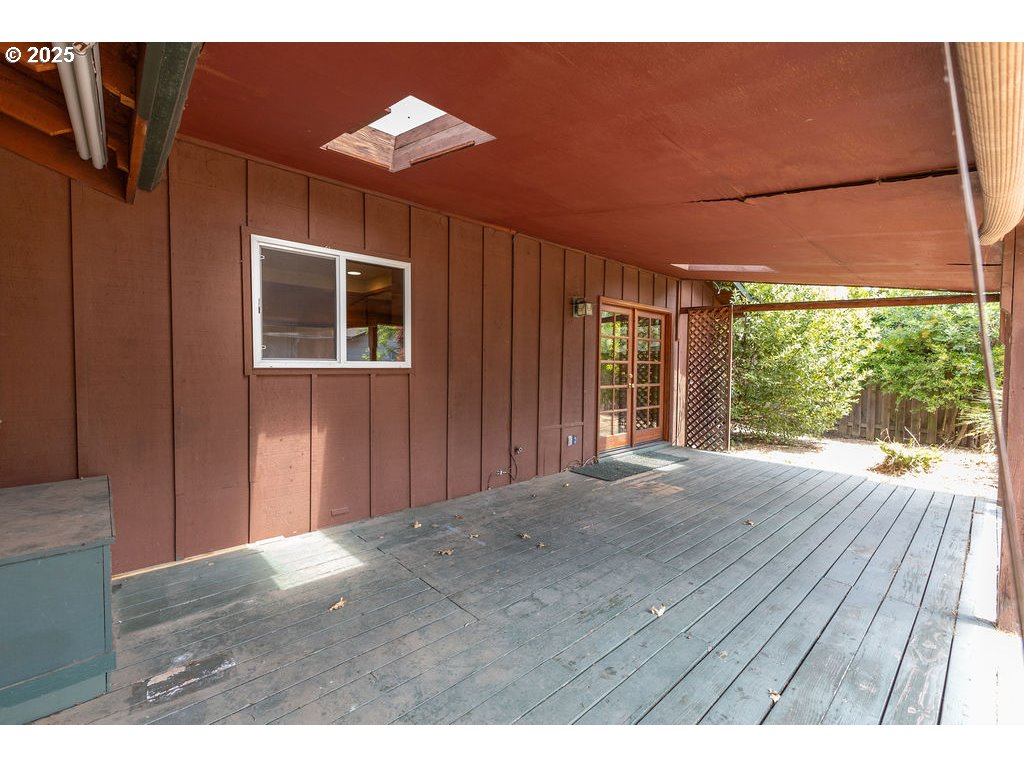 2116 Sally Way Eugene, OR 97401 - Photo 33 of 39 a view of an empty room with a window and wooden floor
