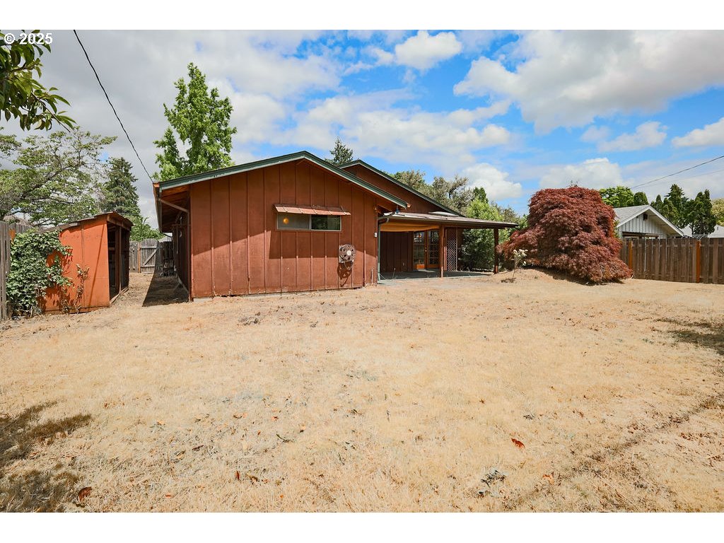2116 Sally Way Eugene, OR 97401 - Photo 36 of 39 a view of a wooden house with a yard