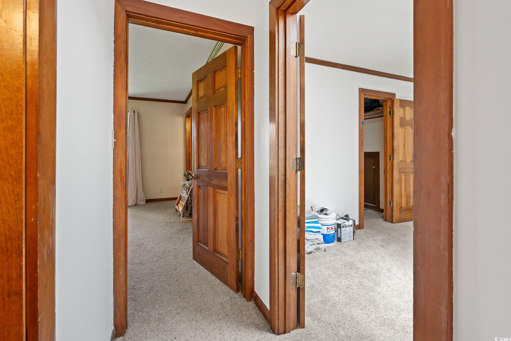 3533 Lighthouse Way Myrtle Beach, SC 29577 - Photo 19 of 40 Corridor with carpet and ornamental molding