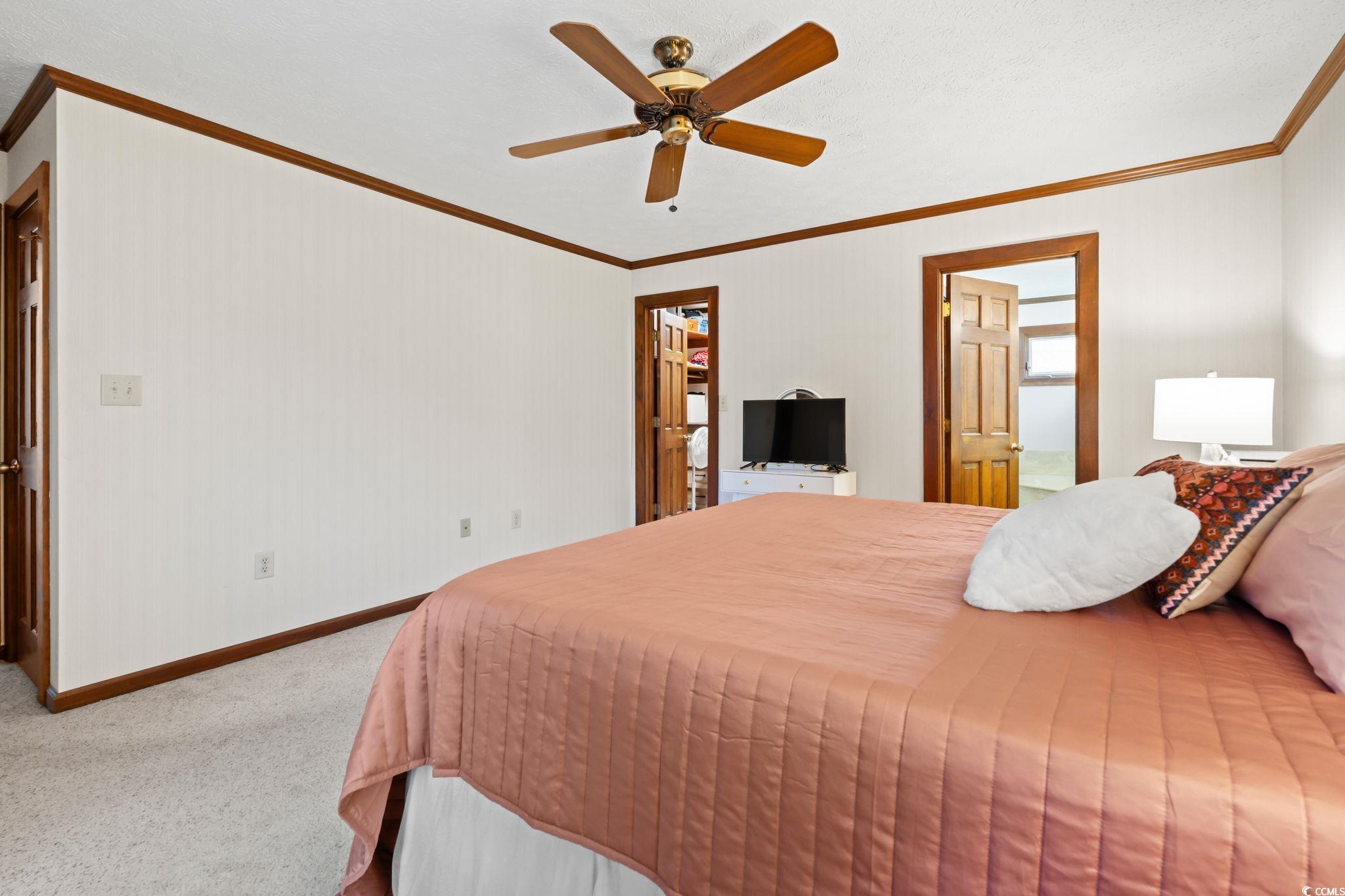 3533 Lighthouse Way Myrtle Beach, SC 29577 - Photo 22 of 40 Carpeted bedroom featuring ornamental molding and ceiling fan