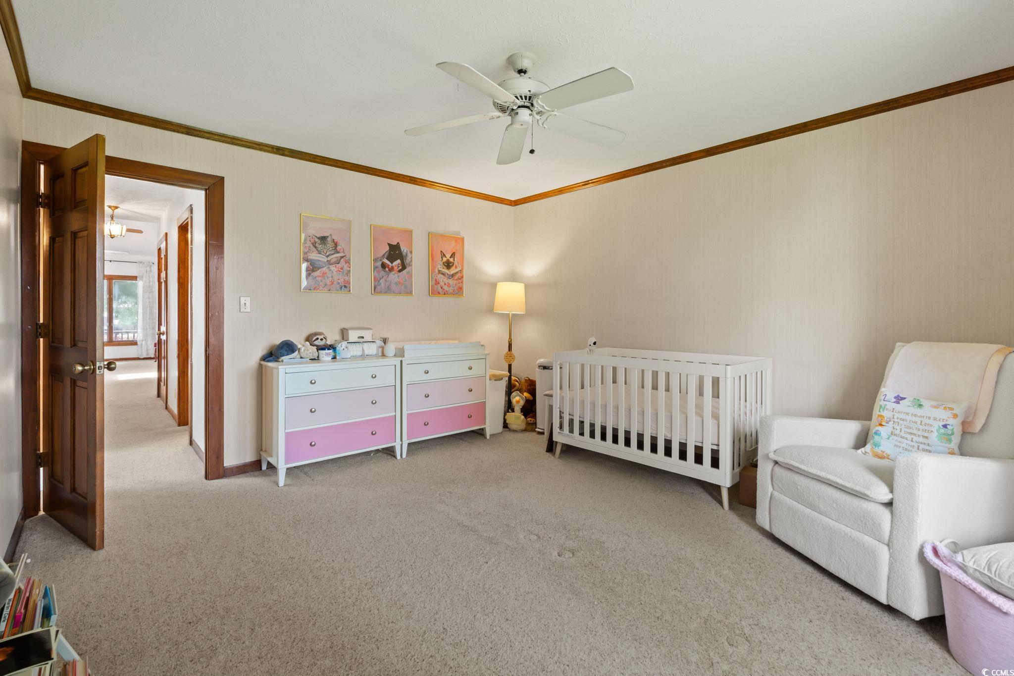 3533 Lighthouse Way Myrtle Beach, SC 29577 - Photo 25 of 40 Carpeted bedroom featuring crown molding, a crib, and a ceiling fan