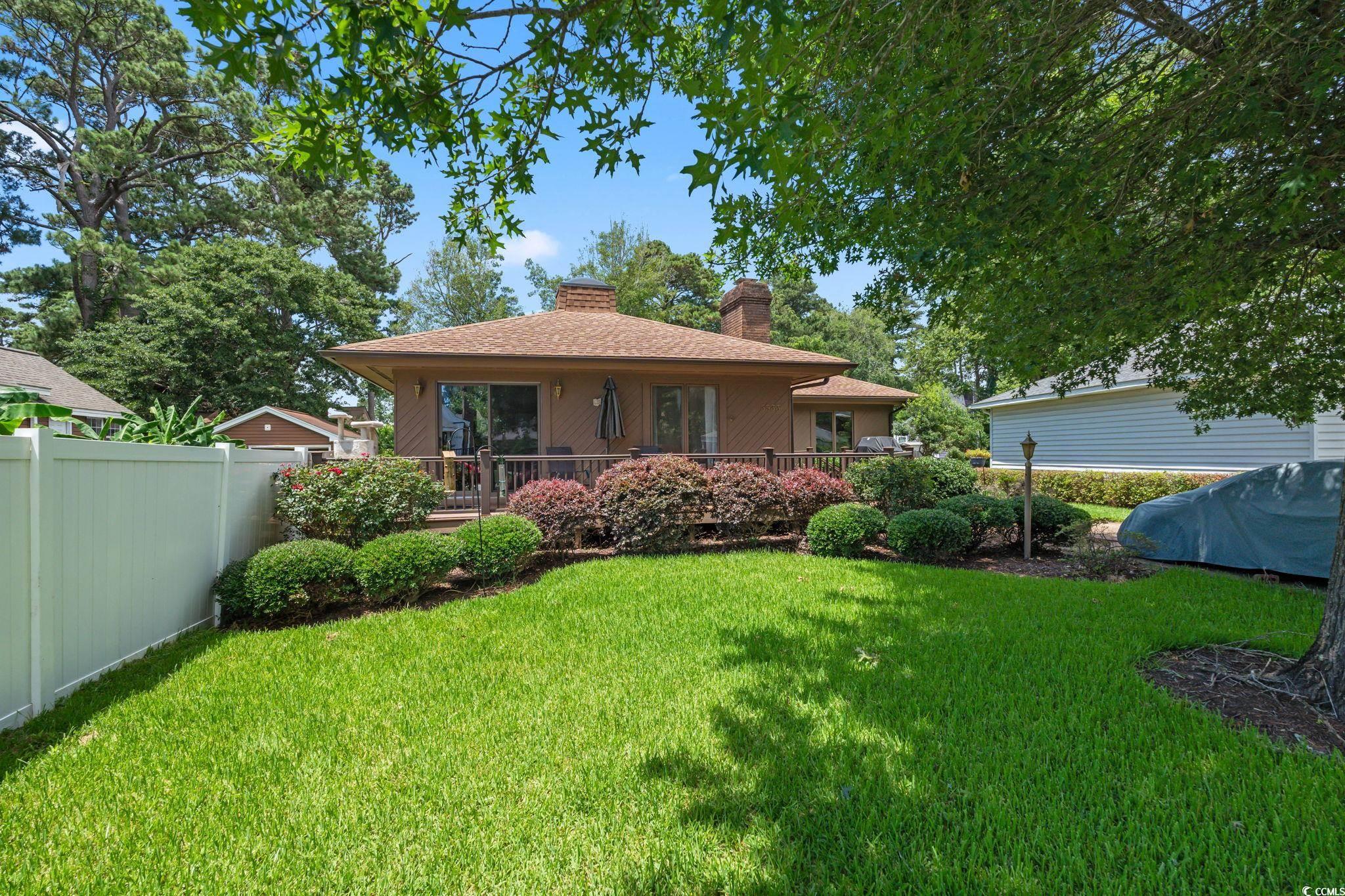 3533 Lighthouse Way Myrtle Beach, SC 29577 - Photo 32 of 40 Back of property featuring a chimney
