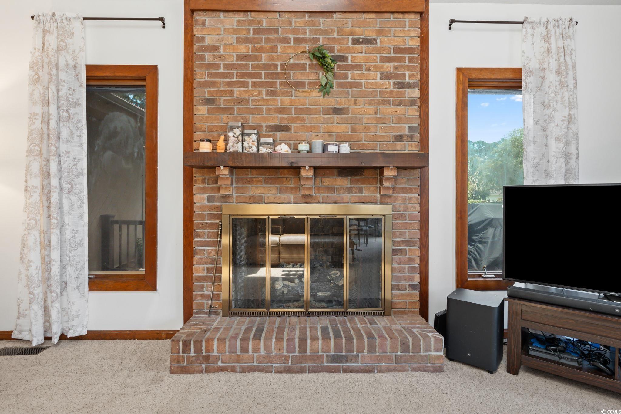 3533 Lighthouse Way Myrtle Beach, SC 29577 - Photo 8 of 40 Living room with a brick fireplace and carpet