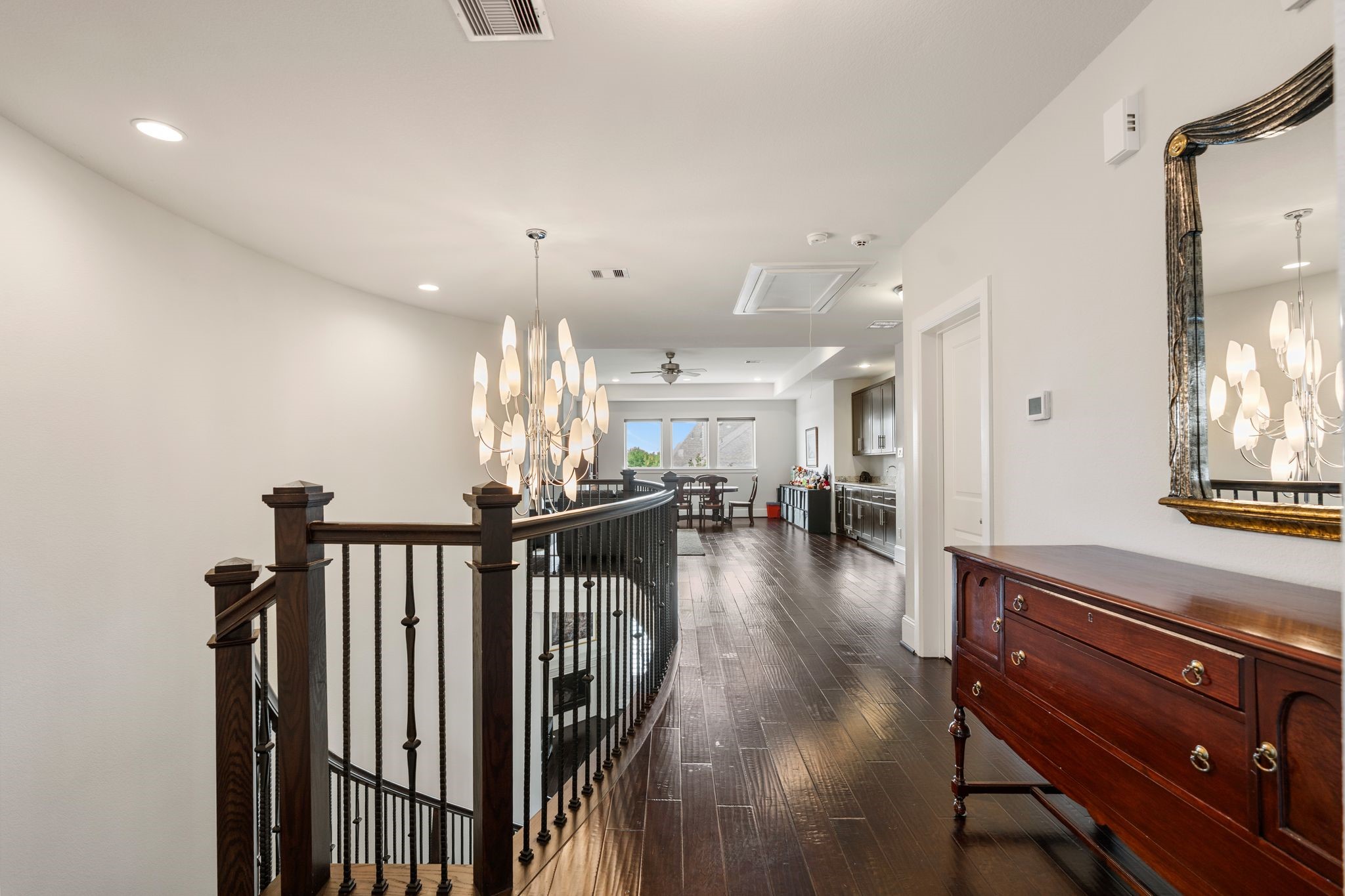 2926 Fairmont Ridge Lane Katy, TX 77494 - Photo 39 of 49 a view of a hallway with wooden floor and stairs
