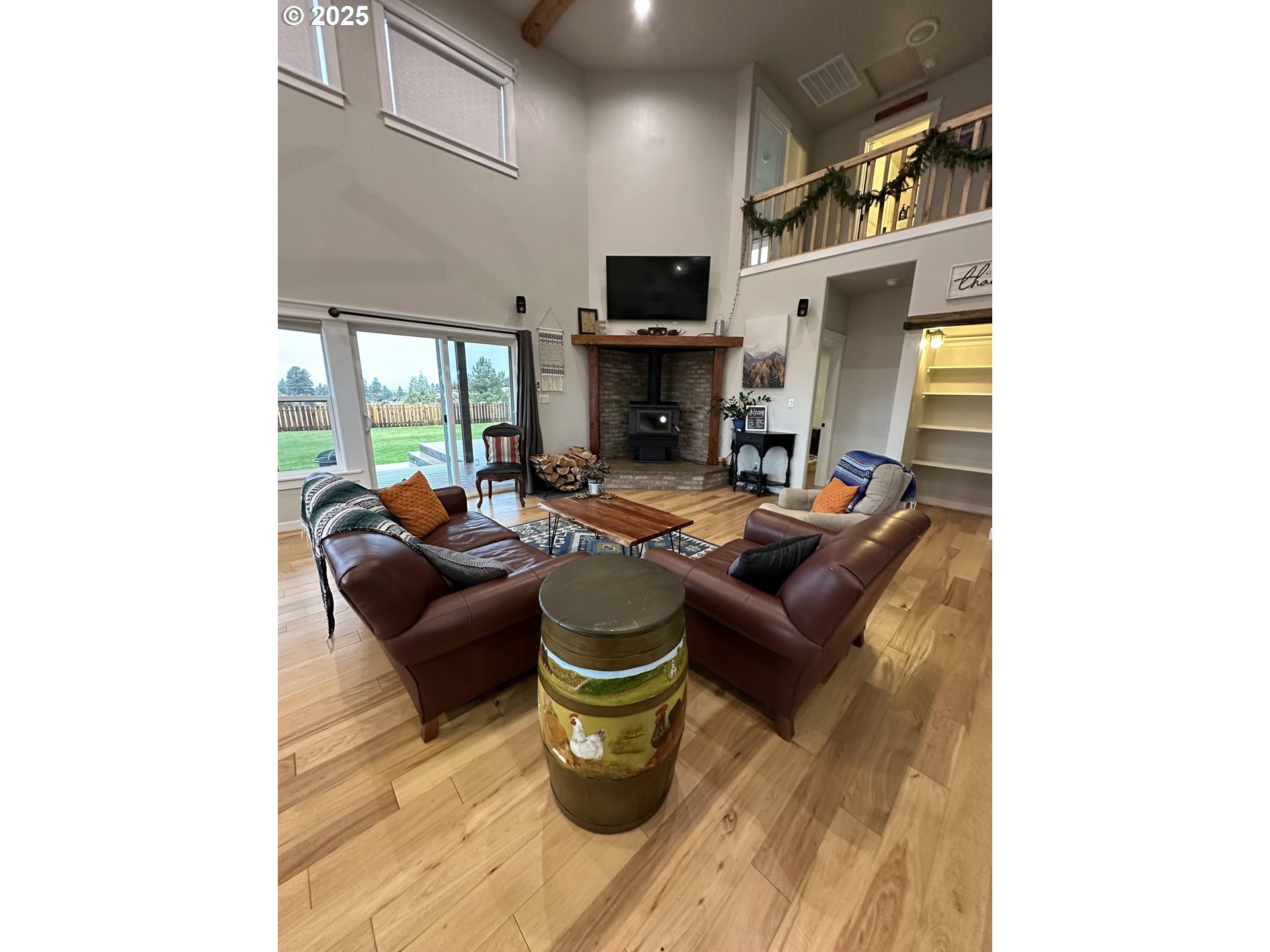 34786 Pleasant View Road Chiloquin, OR 97624 - Photo 11 of 48 a living room with fireplace furniture and a flat screen tv