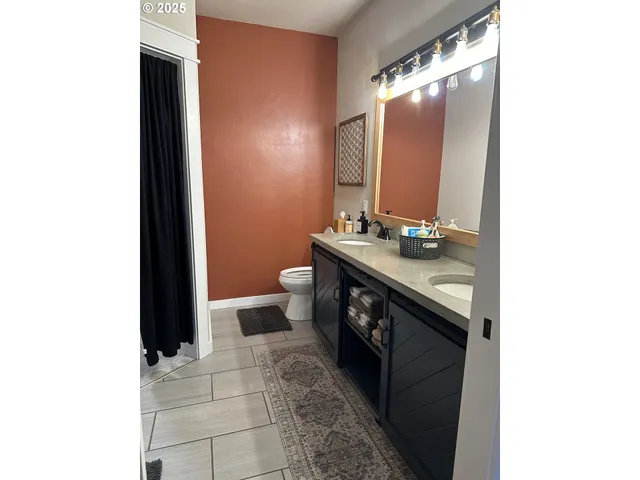 a bathroom with a glass shower door