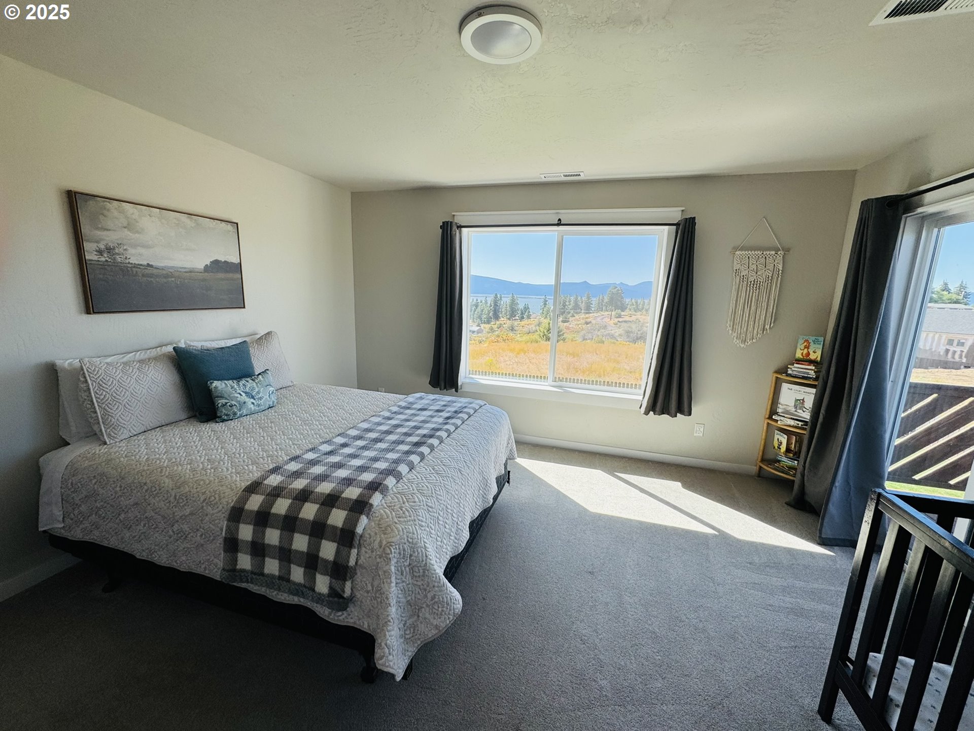 34786 Pleasant View Road Chiloquin, OR 97624 - Photo 27 of 48 a bedroom with a bed and a flat tv screen on the dresser