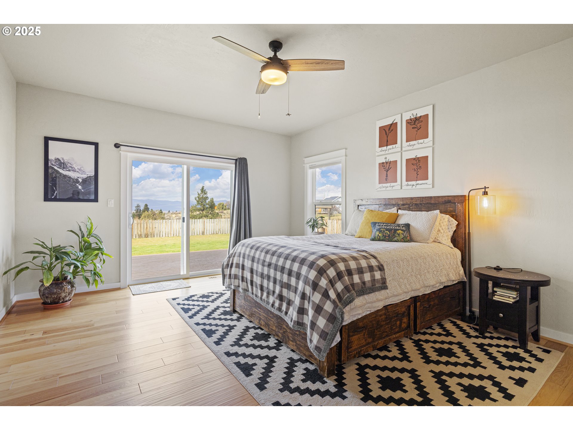 34786 Pleasant View Road Chiloquin, OR 97624 - Photo 44 of 48 a bedroom with a bed a table and a potted plant