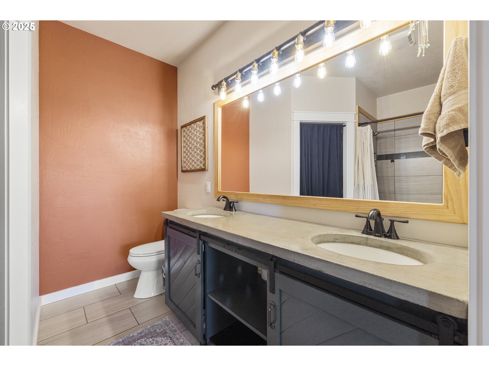 34786 Pleasant View Road Chiloquin, OR 97624 - Photo 47 of 48 a bathroom with a granite countertop sink a toilet and a mirror